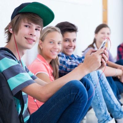 teenagers sitting in a hallway